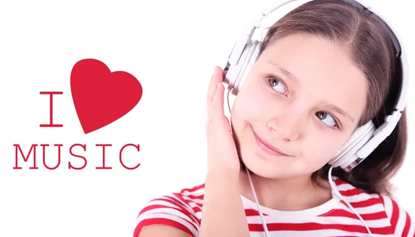 Красивая маленькая девочка слушает музыку, изолированная на белом — стоковое фото