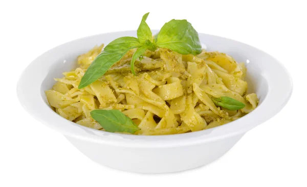 Heerlijke pasta met pesto op plaat geïsoleerd op wit — Stockfoto