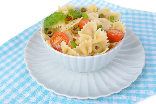 Delicious pasta with tomatoes on plate on table close-up — Stock Photo, Image