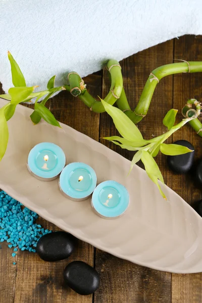 Beautiful spa setting with bamboo on wooden background — Stock Photo, Image