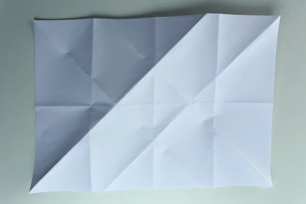 Gevouwen wit vel papier close-up — Stockfoto