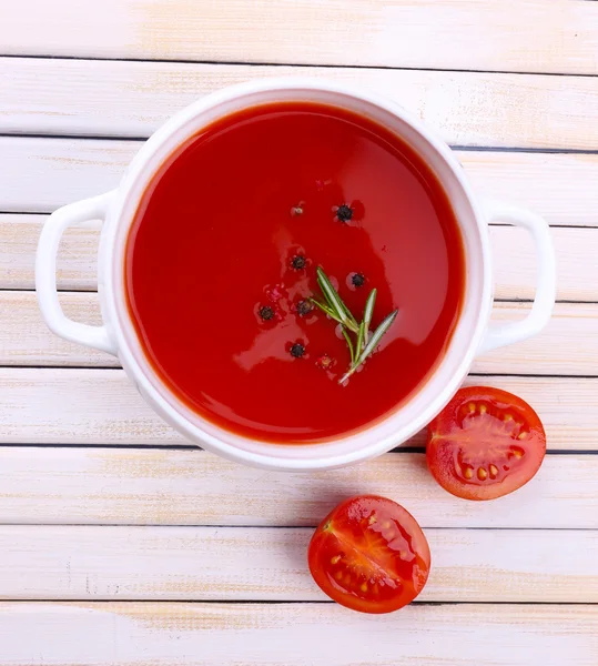 Tasty tomato soup on wooden table — Stock Photo, Image