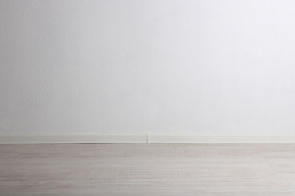 Empty room with wall and wooden floor