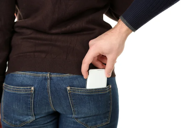 Pickpocket estão roubando telefone celular do bolso traseiro, de perto, isolado no branco — Fotografia de Stock