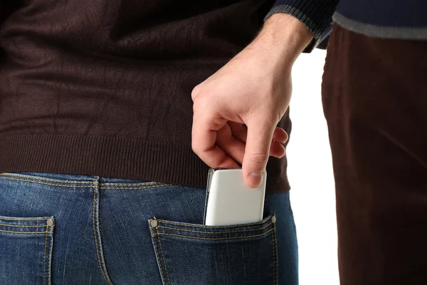 Pickpocket volent téléphone portable de poche arrière, gros plan, isolé sur blanc — Photo