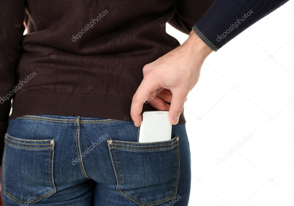 Pickpocket are stealing mobile phone from back pocket, close up, isolated on white