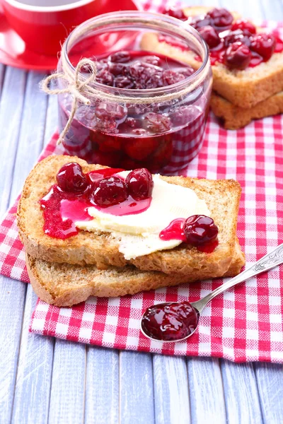 Delicious toast with jam on table close-up — Stock Photo, Image