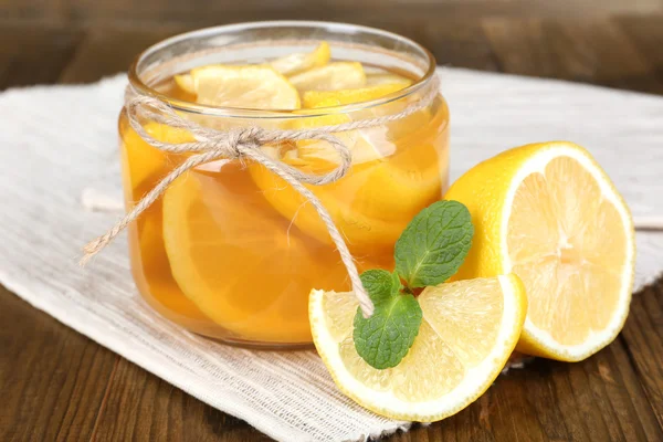 Tasty lemon jam on table close-up — Stock Photo, Image