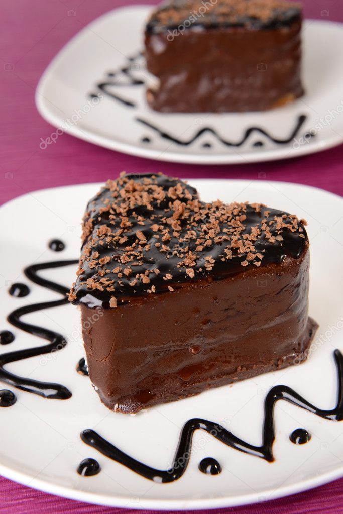 Sweet cakes with chocolate on plate on table close-up