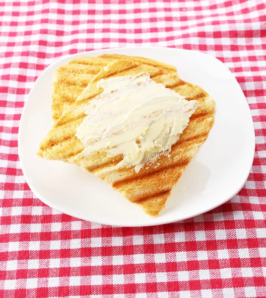 Grilovaný chléb s máslem na ubrus — Stock fotografie
