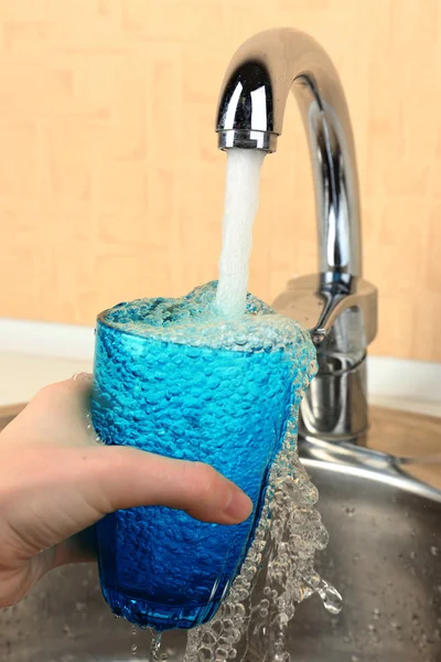 Filling up glass of water — Stock Photo, Image