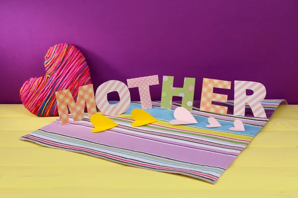 Mother- lettering of handmade paper letters on purple background — Stock Photo, Image