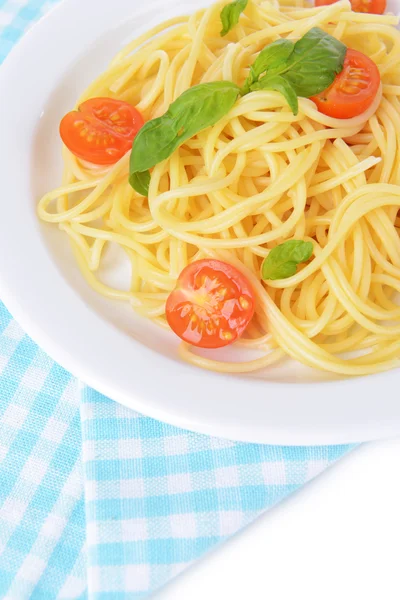 Delicious spaghetti with tomatoes on plate on table close-up — Stock Photo, Image