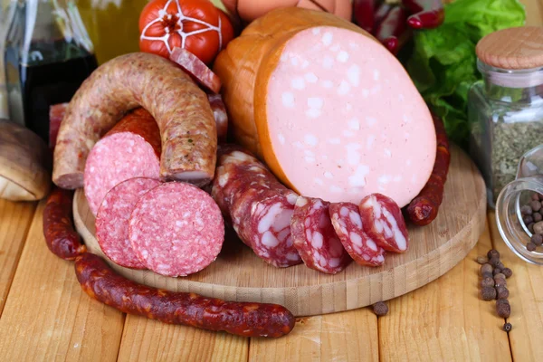 Different sausages on wooden table close-up — Stock Photo, Image