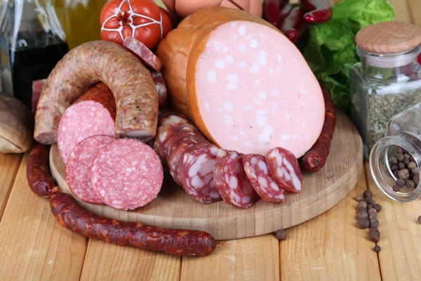 Different sausages on wooden table close-up — Stock Photo, Image