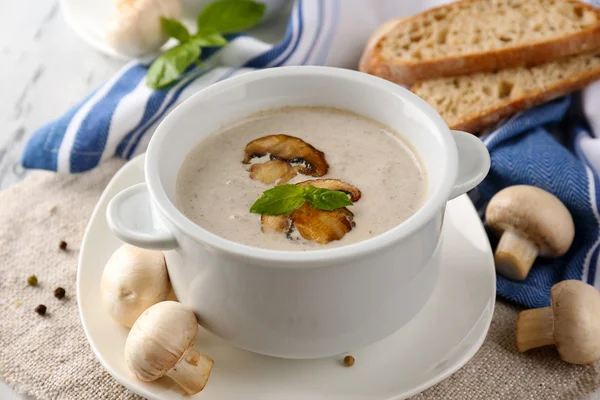 Mushroom soup in white pots, on napkin, on wooden background — Stock Photo, Image