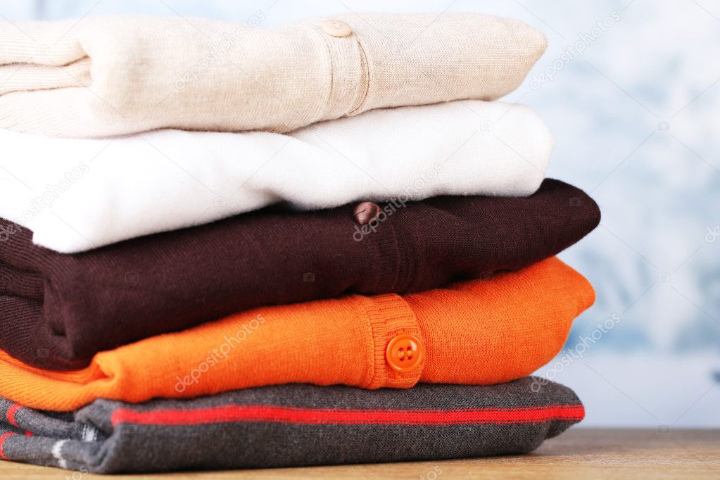 Stack of colorful clothes, on light background