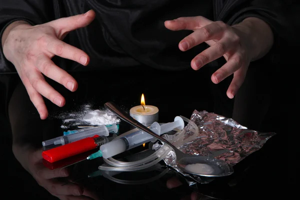 Drug addict with syringe on black background — Stock Photo, Image