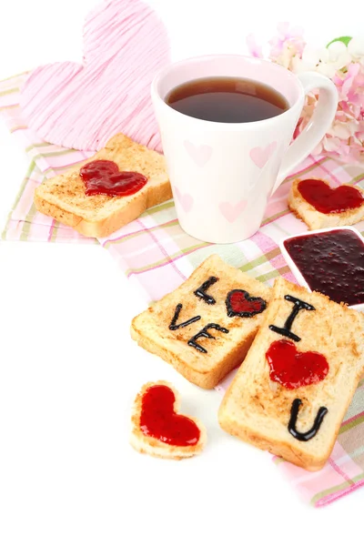 Delicioso brindis con mermelada y taza de té en primer plano de la mesa — Foto de Stock