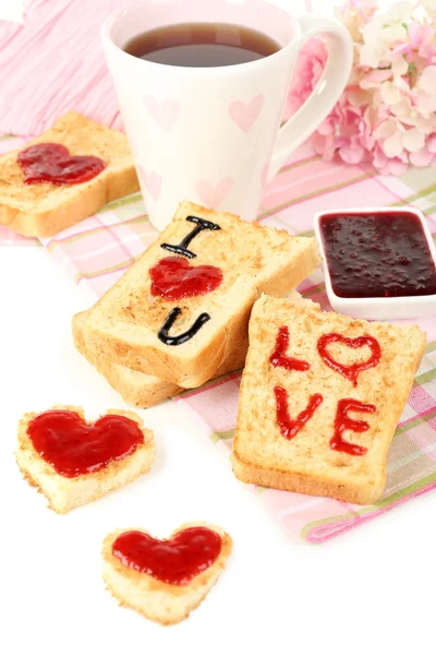 Delicious toast with jam and cup of tea on table close-up — Stock Photo, Image