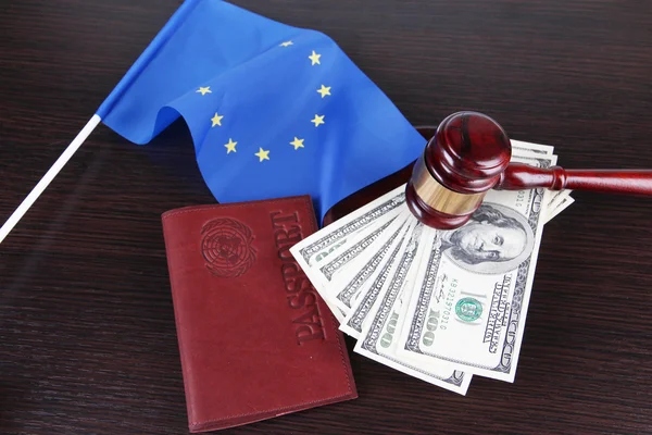 Gavel, money, passport and flag of Europe, on wooden background — Stock Photo, Image