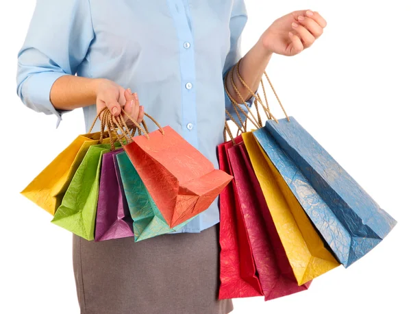 Young woman holding colorful shopping bags in her hand, isolated on white — Stock Photo, Image