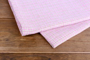 Kitchen towels on wooden background