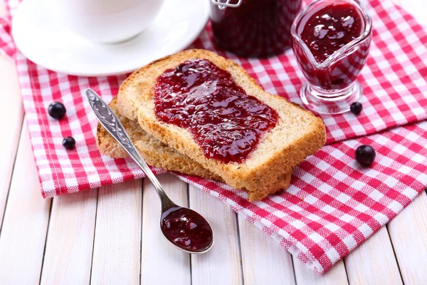 Delicious toast with jam on table close-up — Stock Photo, Image