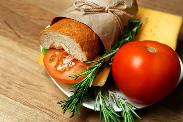 Fresh and tasty sandwich on wooden background — Stock Photo, Image