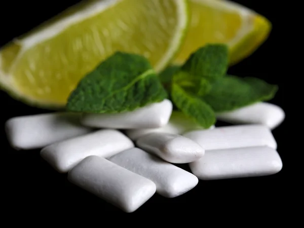 Chewing gum with fruit taste, isolated on black — Stock Photo, Image