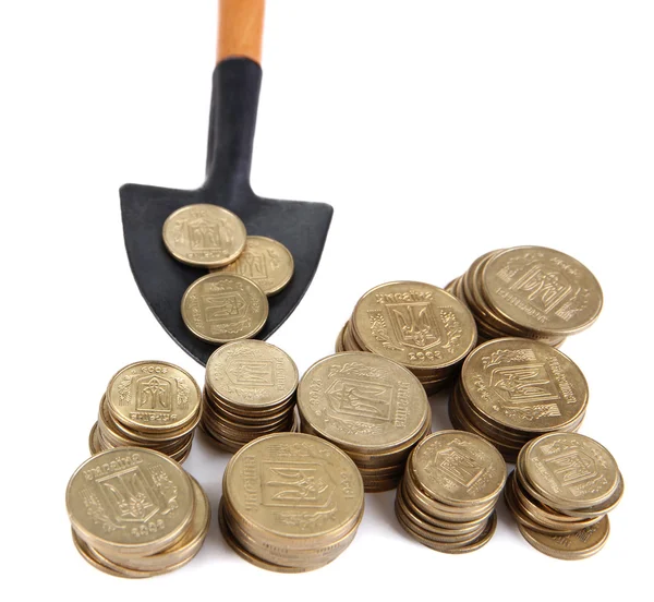 Coins with shovel isolated on white — Stock Photo, Image