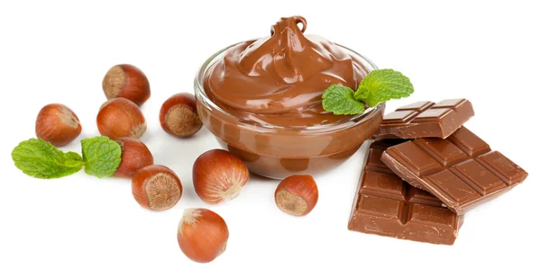 Sweet chocolate hazelnut spread with whole nuts and mint isolated on white — Stock Photo, Image