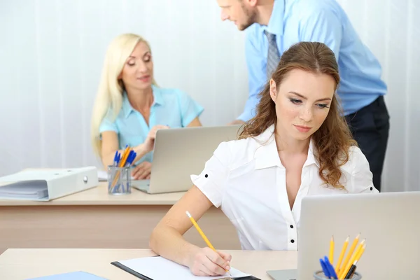 Office workers in workplace Stock Photo