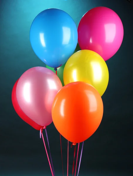 Bright balloons on blue background — Stock Photo, Image