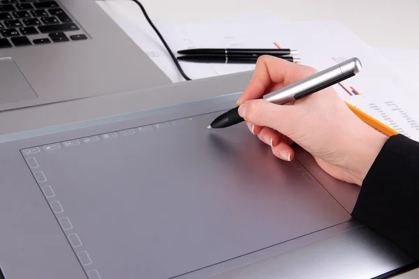 Female hand using graphics tablet on table close up — Stock Photo, Image