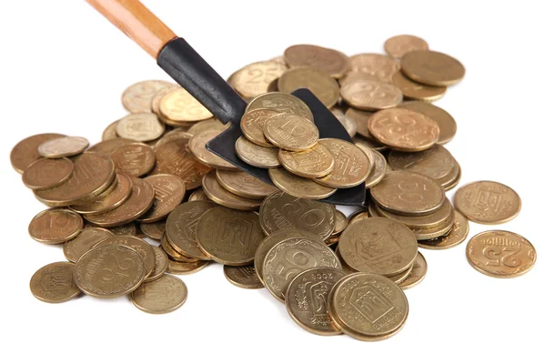 Coins with shovel isolated on white — Stock Photo, Image