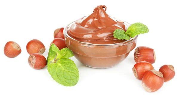 Sweet chocolate hazelnut spread with whole nuts and mint isolated on white — Stock Photo, Image