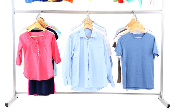 Different clothes on hangers, on gray background — Stock Photo, Image