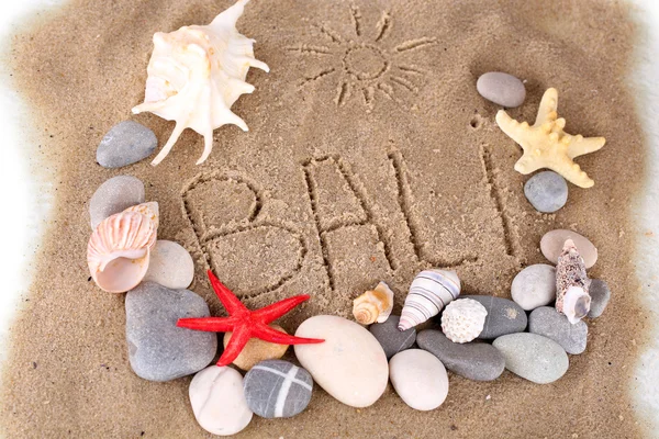 Inscription Bali on wet sand close-up background — Stock Photo, Image