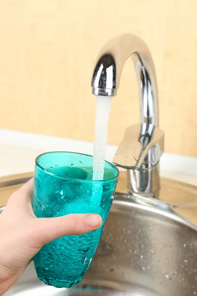 Filling up glass of water — Stock Photo, Image