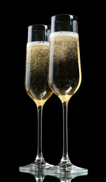 Glasses of champagne, on black background — Stock Photo, Image