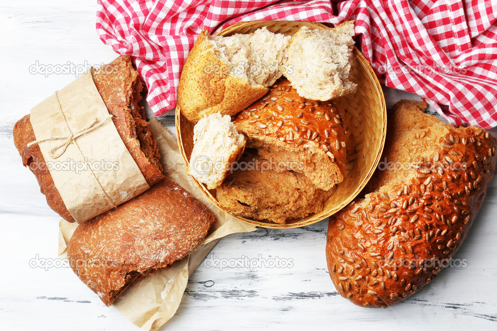 Breaking bread on wooden table