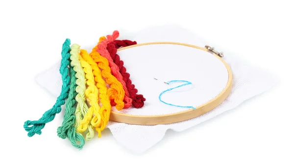 The embroidery hoop with canvas and bright sewing threads for embroidery isolated on white — Stock Photo, Image