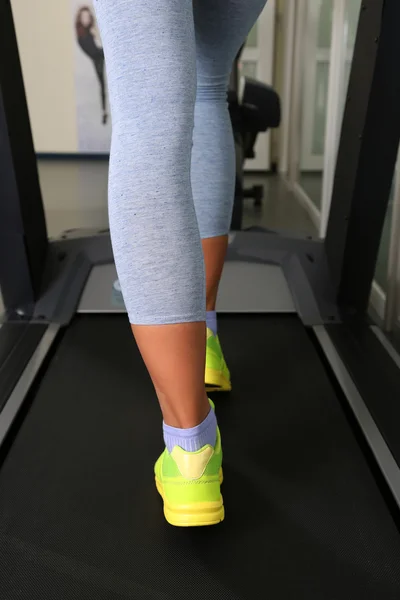 Women legs on treadmill in gum — Stock Photo, Image