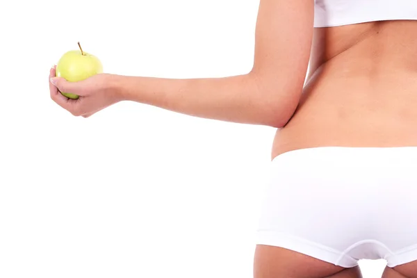 Beautiful young woman with green apple isolated on white — Stock Photo, Image