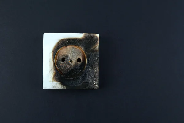 Burned plug socket close up — Stock Photo, Image