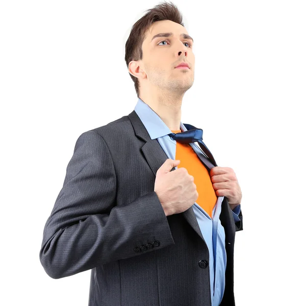 Joven hombre de negocios desgarrando su camisa revelando traje de superhéroe, aislado en blanco — Foto de Stock