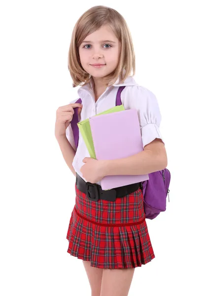 Bella bambina con zaino che tiene libri isolati su bianco — Foto Stock