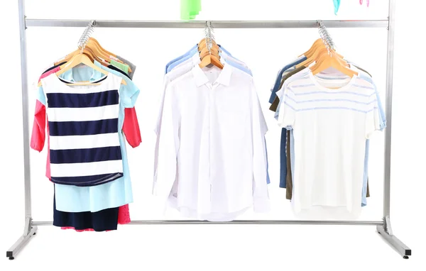 Verschillende kleding op hangers, op grijze achtergrond — Stockfoto