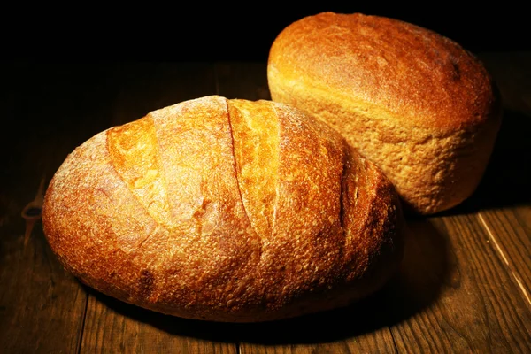 Loaf of bread on dark background — Stok Foto